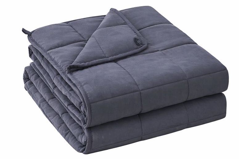 Folded dark gray weighted blanket with quilted square stitching for stress-relief comfort